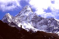 Trekker standing below Ama Dablam